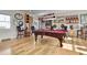 Basement with hardwood floors, a pool table, a wet bar, and unique decor, perfect for entertainment at 1857 W Canning Dr, Mount Pleasant, SC 29466