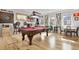 Basement featuring hardwood floors, a pool table, and various wall decorations, creating an entertainment space at 1857 W Canning Dr, Mount Pleasant, SC 29466