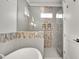 Modern bathroom featuring decorative shower and bathtub with glass door at 1857 W Canning Dr, Mount Pleasant, SC 29466
