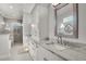 Elegant bathroom with dual sinks, granite countertops, and a decorative mirror at 1857 W Canning Dr, Mount Pleasant, SC 29466