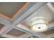 Close up of a coffered ceiling with recessed lighting and a decorative drum light fixture at 1857 W Canning Dr, Mount Pleasant, SC 29466