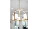 Close up of an industrial style chandelier with decorative hanging chain at 1857 W Canning Dr, Mount Pleasant, SC 29466