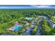 Aerial view of community pools with ample seating, surrounded by lush greenery and well-maintained grounds at 1857 W Canning Dr, Mount Pleasant, SC 29466