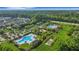 Aerial view featuring multiple community pools, tennis courts, and well-maintained landscaping at 1857 W Canning Dr, Mount Pleasant, SC 29466