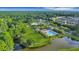 Overhead view of a well-maintained community pool and recreation area surrounded by lush greenery and homes at 1857 W Canning Dr, Mount Pleasant, SC 29466