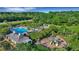 Aerial view of a community pool, playground, and recreation center surrounded by lush greenery at 1857 W Canning Dr, Mount Pleasant, SC 29466
