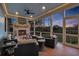 Relaxing covered deck with a brick fireplace, comfortable seating, a ceiling fan and a view of the outdoors at 1857 W Canning Dr, Mount Pleasant, SC 29466