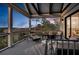 Relaxing covered deck area with comfortable lounge seating and views of the sunset and landscape at 1857 W Canning Dr, Mount Pleasant, SC 29466