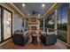 Inviting covered patio with outdoor seating, a cozy fireplace, and a ceiling fan for comfortable entertaining at 1857 W Canning Dr, Mount Pleasant, SC 29466