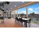Spacious covered patio features an outdoor dining table, spiral staircase, and a backyard view at 1857 W Canning Dr, Mount Pleasant, SC 29466