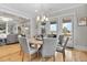 Open dining room with a round table, hardwood floors, and natural lighting at 1857 W Canning Dr, Mount Pleasant, SC 29466