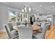 Charming dining room area featuring a stylish chandelier and seating for six with hardwood floors throughout at 1857 W Canning Dr, Mount Pleasant, SC 29466