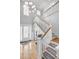 Bright foyer boasts a staircase with hardwood steps and white railings, leading to the upper levels at 1857 W Canning Dr, Mount Pleasant, SC 29466