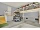 Well-organized garage featuring a golf cart, loft storage, and ample space at 1857 W Canning Dr, Mount Pleasant, SC 29466