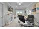 Inviting home office featuring a modern desk, comfortable seating, and ample natural light, ideal for productivity at 1857 W Canning Dr, Mount Pleasant, SC 29466