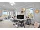 Bright and airy home office with modern desk, comfortable seating area, and large windows providing natural light at 1857 W Canning Dr, Mount Pleasant, SC 29466