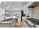 Spacious kitchen featuring stainless steel appliances, a large island with a sink, and an open layout at 1857 W Canning Dr, Mount Pleasant, SC 29466