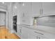 Modern kitchen with built-in stainless steel ovens and white cabinetry at 1857 W Canning Dr, Mount Pleasant, SC 29466