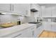 Modern kitchen with stainless steel appliances, stone countertops, and a stylish tile backsplash at 1857 W Canning Dr, Mount Pleasant, SC 29466
