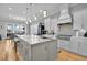 Bright kitchen features a large island, stainless steel appliances, and an open layout to the dining area at 1857 W Canning Dr, Mount Pleasant, SC 29466