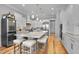 Large, stylish kitchen features a center island with seating and state-of-the-art stainless steel appliances at 1857 W Canning Dr, Mount Pleasant, SC 29466