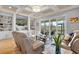 Bright living room featuring a coffered ceiling, hardwood floors, and an entertainment center at 1857 W Canning Dr, Mount Pleasant, SC 29466
