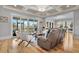 Sun-filled living room featuring hardwood floors and views of the outdoors at 1857 W Canning Dr, Mount Pleasant, SC 29466