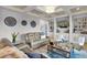 Open concept living room featuring a hardwood floors, recessed lighting, and a mounted television at 1857 W Canning Dr, Mount Pleasant, SC 29466