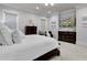 Spacious main bedroom featuring a king bed, dual dressers, and a comfortable chair for reading at 1857 W Canning Dr, Mount Pleasant, SC 29466