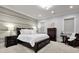 Comfortable bedroom with a king-sized bed, soft lighting, and a decorative accent wall at 1857 W Canning Dr, Mount Pleasant, SC 29466