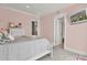 Cozy bedroom with pink walls, soft carpet, and a comfortable bed, creating a warm and inviting space at 1857 W Canning Dr, Mount Pleasant, SC 29466