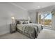 Beautifully appointed main bedroom with a large bed, neutral tones, and access to the balcony at 1857 W Canning Dr, Mount Pleasant, SC 29466