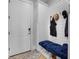 Mudroom features shiplap walls, storage cabinets, and a bench with a blue cushion by the front door at 1857 W Canning Dr, Mount Pleasant, SC 29466