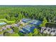 Aerial view of community tennis courts and amenity center, surrounded by lush landscaping at 1857 W Canning Dr, Mount Pleasant, SC 29466
