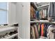 Organized walk-in closet featuring shelving for shoes and rods for hanging clothes at 1857 W Canning Dr, Mount Pleasant, SC 29466