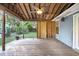 Wooden back porch with a ceiling fan, wood support beams, and views of backyard at 188 Ponderosa Dr, Ladson, SC 29456