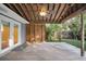Wooden back porch with a ceiling fan, wood support beams, and views of backyard at 188 Ponderosa Dr, Ladson, SC 29456