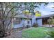 Backyard features blue siding, a covered wood porch, green grass, and landscaping at 188 Ponderosa Dr, Ladson, SC 29456