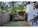 The fenced backyard features a stacked woodpile at 188 Ponderosa Dr, Ladson, SC 29456