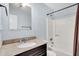 Bathroom features a granite-topped vanity, a bathtub, and a modern shower at 188 Ponderosa Dr, Ladson, SC 29456