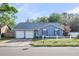 Charming blue single-story home with a two-car garage and well-maintained front yard at 188 Ponderosa Dr, Ladson, SC 29456