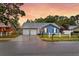 Beautiful blue home with a two-car garage, white picket fence, and twilight sky at 188 Ponderosa Dr, Ladson, SC 29456