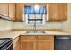 Bright kitchen with a stainless steel sink, and wood-look flooring at 188 Ponderosa Dr, Ladson, SC 29456