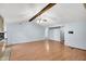 Open-concept living room with beam ceilings and wood-look flooring at 188 Ponderosa Dr, Ladson, SC 29456