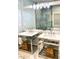 Elegant bathroom featuring double sinks with chrome fixtures, stylish vanities, decorative storage baskets, and a large mirror at 2000 Gray Battery Court Ct, Mount Pleasant, SC 29464
