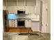 Modern kitchen featuring stainless steel appliances, mosaic backsplash, granite countertops, and white cabinetry at 2000 Gray Battery Court Ct, Mount Pleasant, SC 29464
