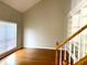 Bright room highlighting the staircase with white railings and wood treads, hardwood floors and built-in bookshelves at 2000 Gray Battery Court Ct, Mount Pleasant, SC 29464
