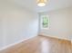 Bedroom featuring wood flooring, white walls, a bright window, and a minimalist design, ready for personalization at 201 Driver Ave, Summerville, SC 29483