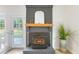 Cozy fireplace with painted brick surround and mantel at 201 Driver Ave, Summerville, SC 29483