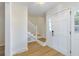 Welcoming foyer with hardwood floors, bright lighting, and stairs leading to the upper level, creating a grand entrance at 201 Driver Ave, Summerville, SC 29483